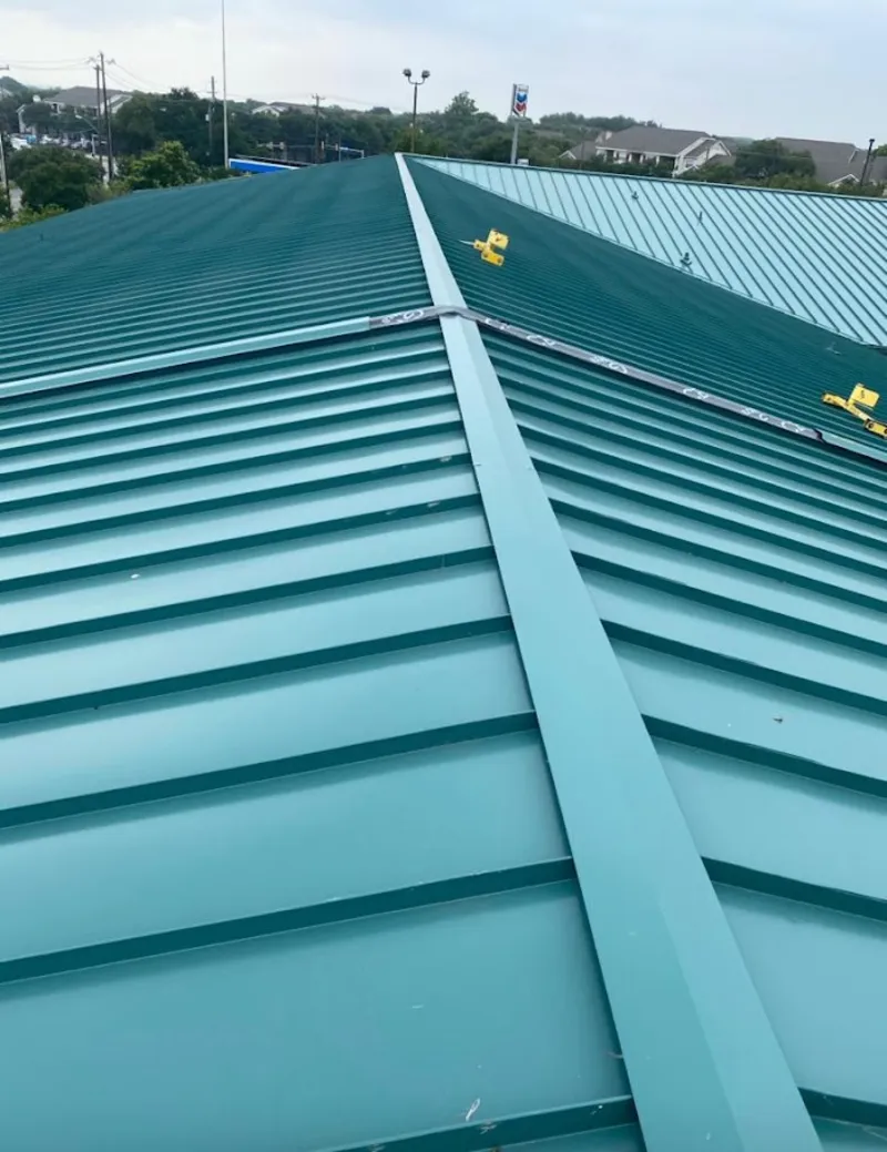 Green commercial metal roof ridge and valley for Metal Roof Repair in Fuquay
